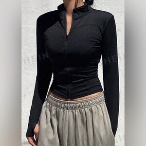 Cute tight-fitting thin black jacket.